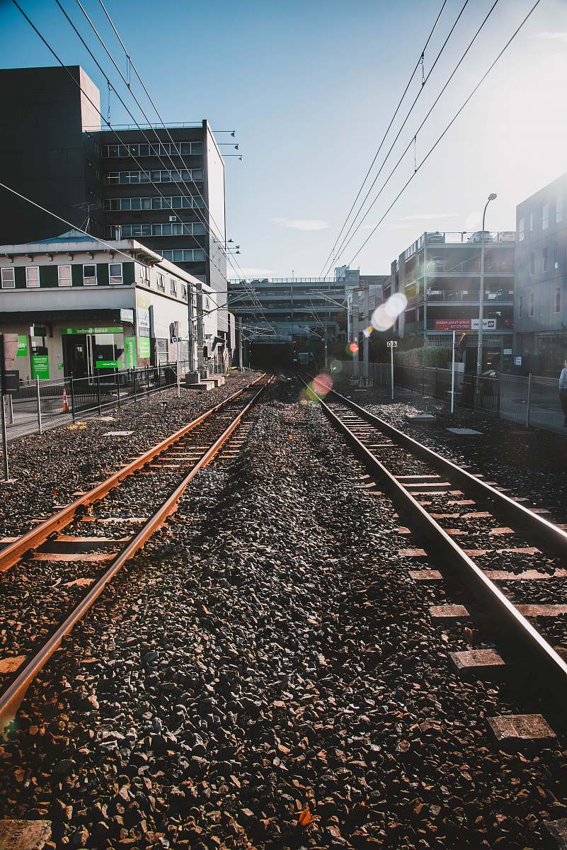 train track railroads under blue sky railway